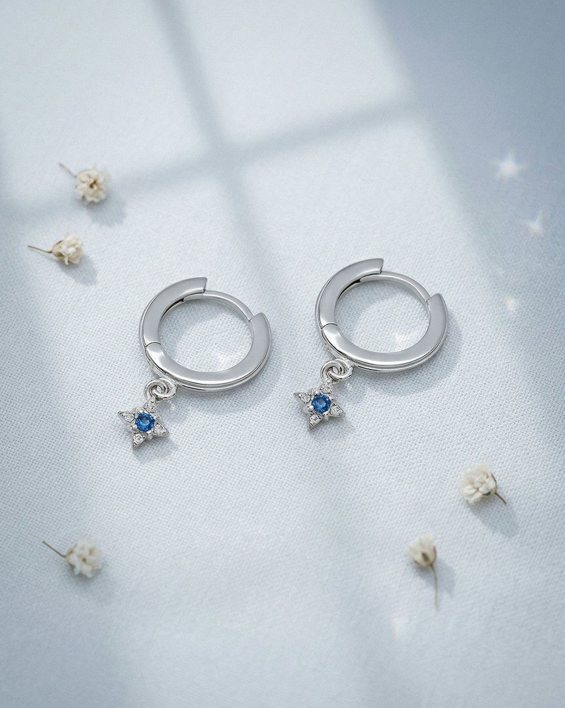 Rhodium Plated Dangling Blue Topaz Mini Hoop Earring