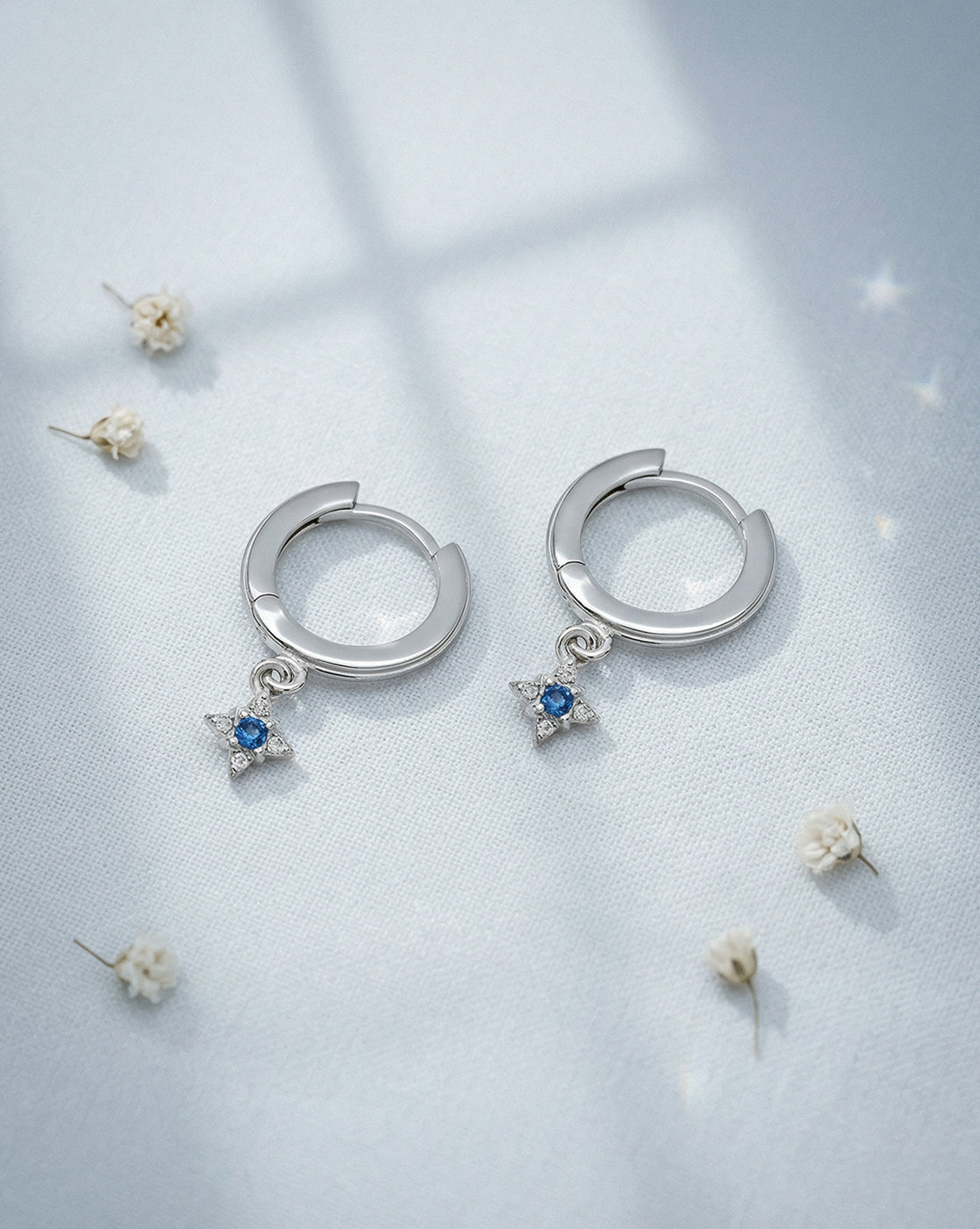 Rhodium Plated Dangling Blue Topaz Mini Hoop Earring