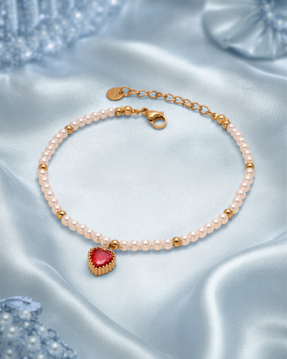 18kt Gold Plated Pearl and Dangling Heart Solitaire Charm Bracelet