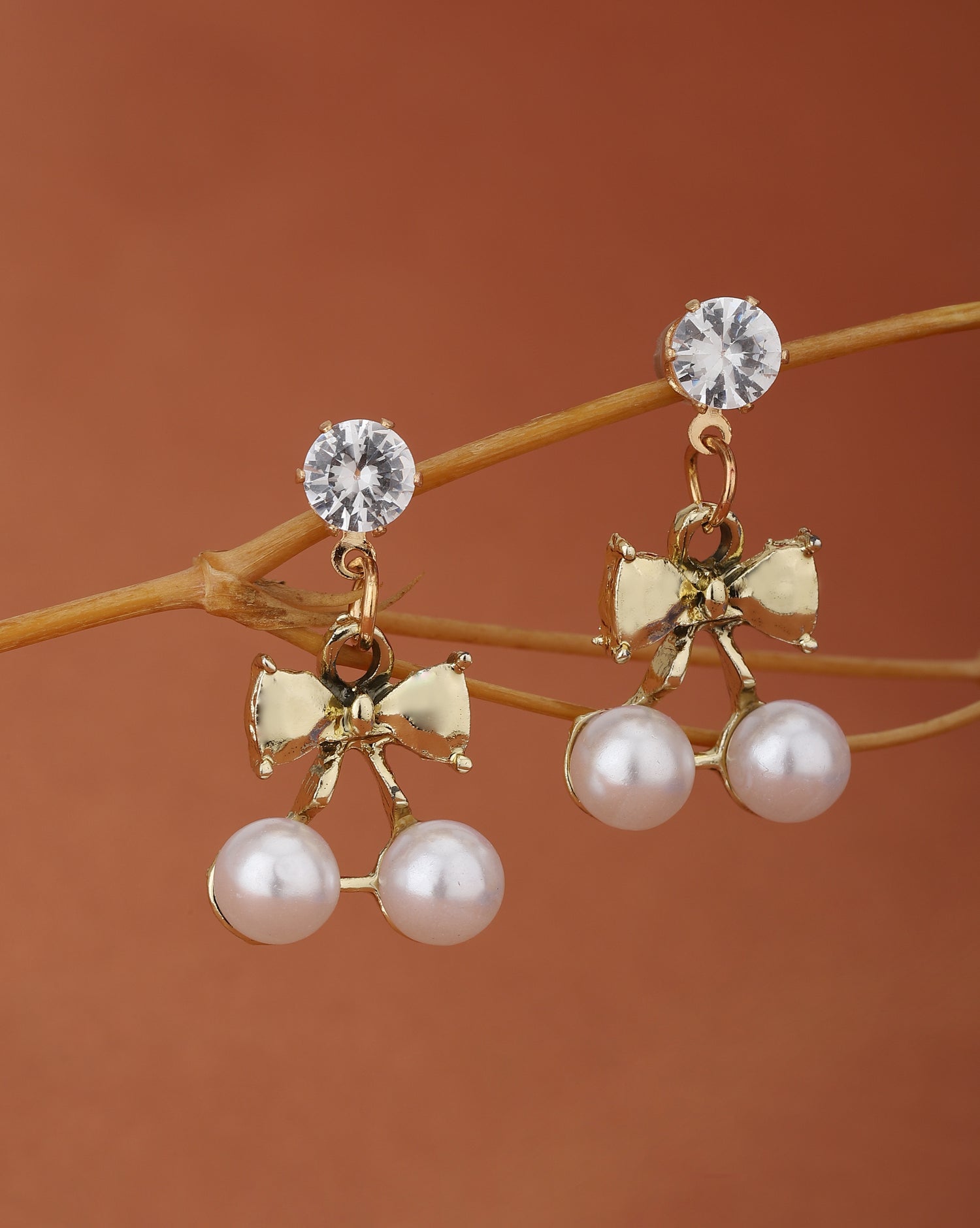 Carlton London Gold Plated Cz White Pearl Bow Drop Earring For Women